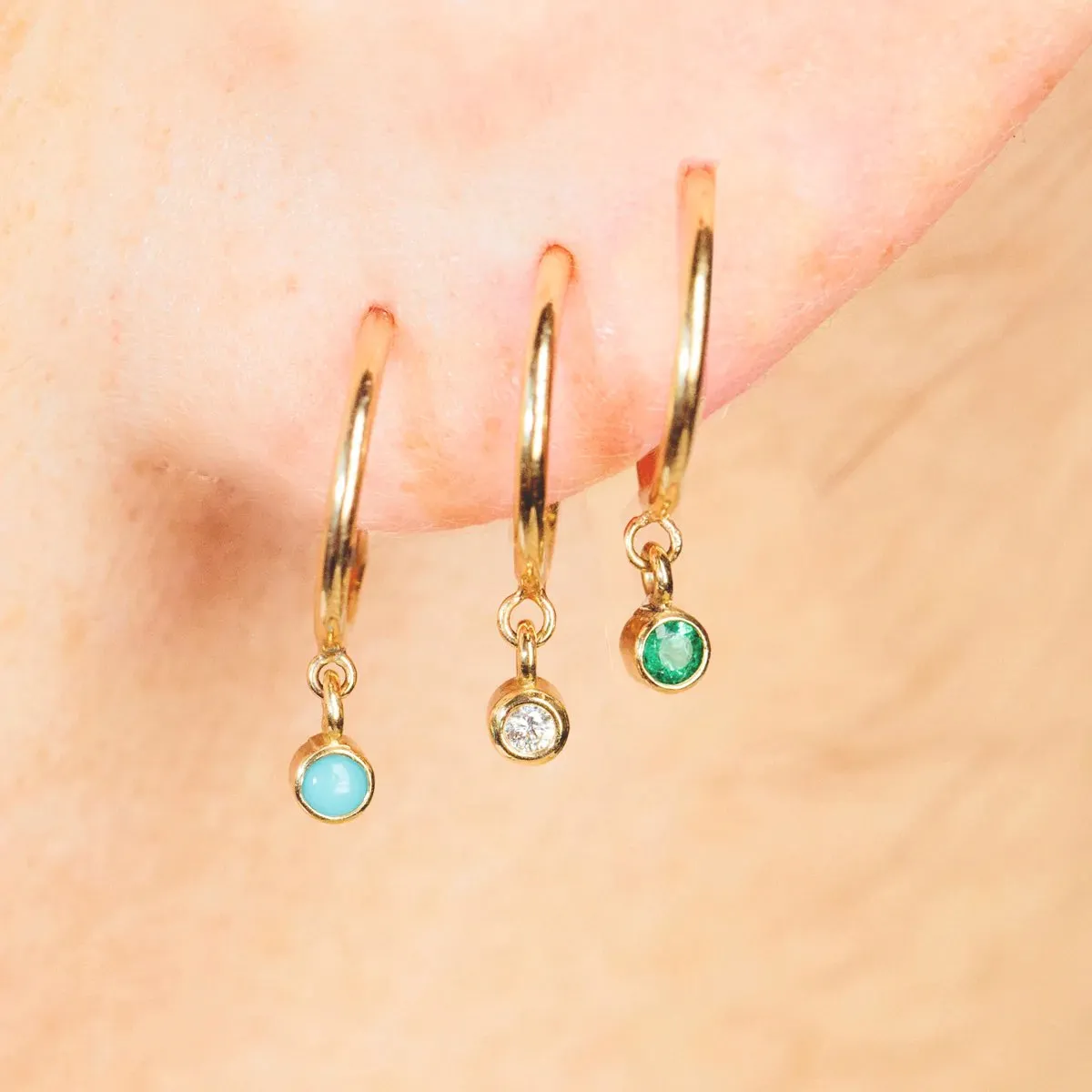 14K Gold and Bezel-Set Emerald Tiny Huggie Hoop Earrings